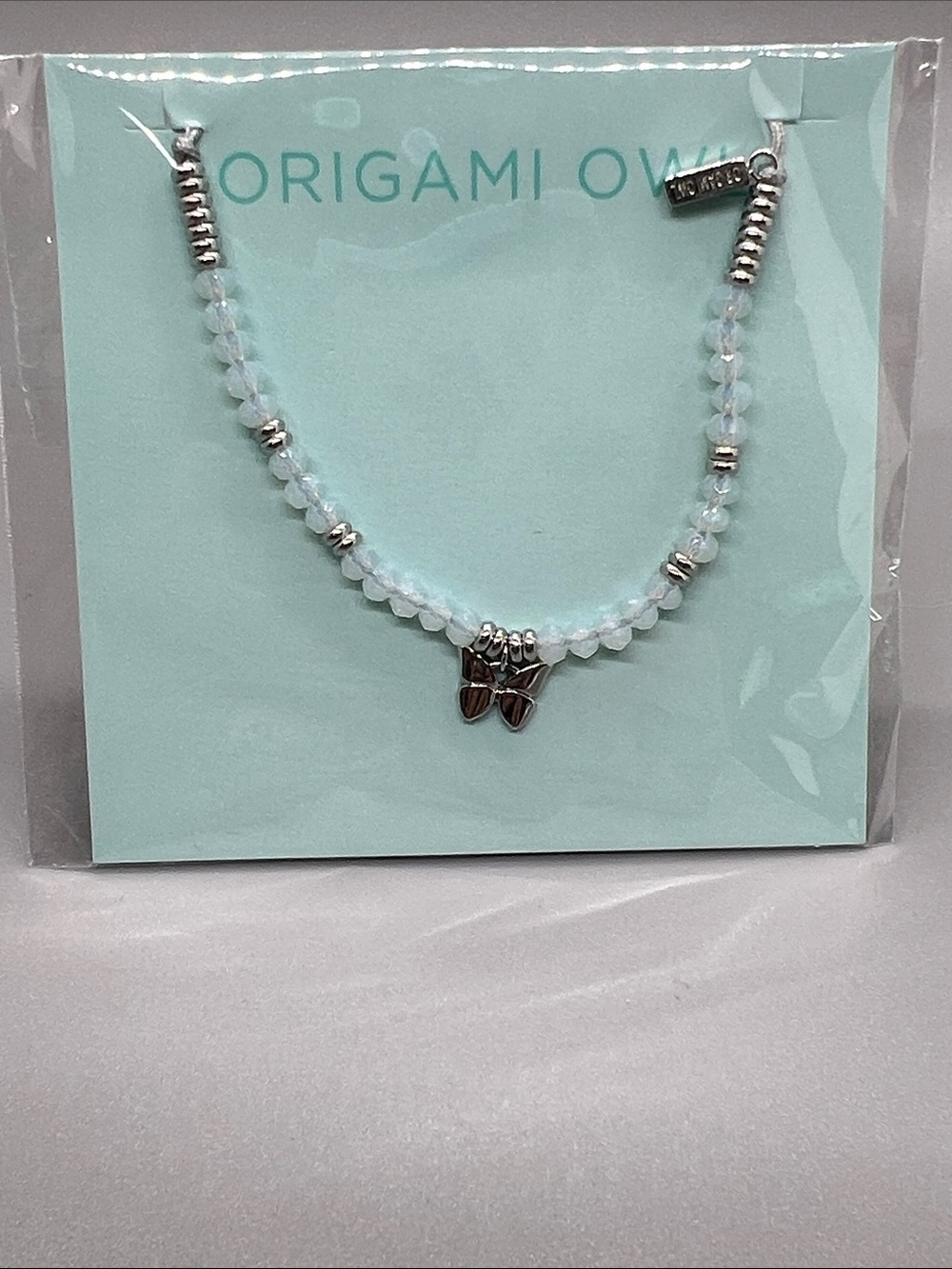 Origami Owl Opalescent White Bead Bracelet with Silver Butterfly Charm